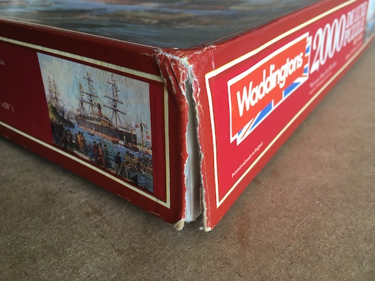 Image of a torn corner of the puzzle 2000, Waddingtons, Welcome Home, Complete