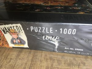 Image of the puzzle 1000, Heye, Wanted! Where is Diamond Dick?, Jean-Jacques Loup, Factory Sealed, Picture of the side