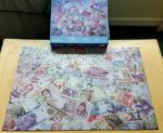 Image of the puzzle 1000, WHSmith, Notes of the World, Complete, Picture of the box and the puzzle assembled