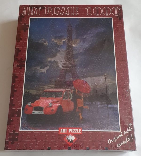Image of the puzzle 1000, Art Puzzle, Eiffel & Rain & Love, Yavuz Bozkurt. Picture of the box.