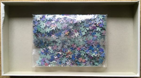 Image of the puzzle 1200, Schmidt, Masquerade, by Gwen Connelly, Sealed Bag, Picture of the bag