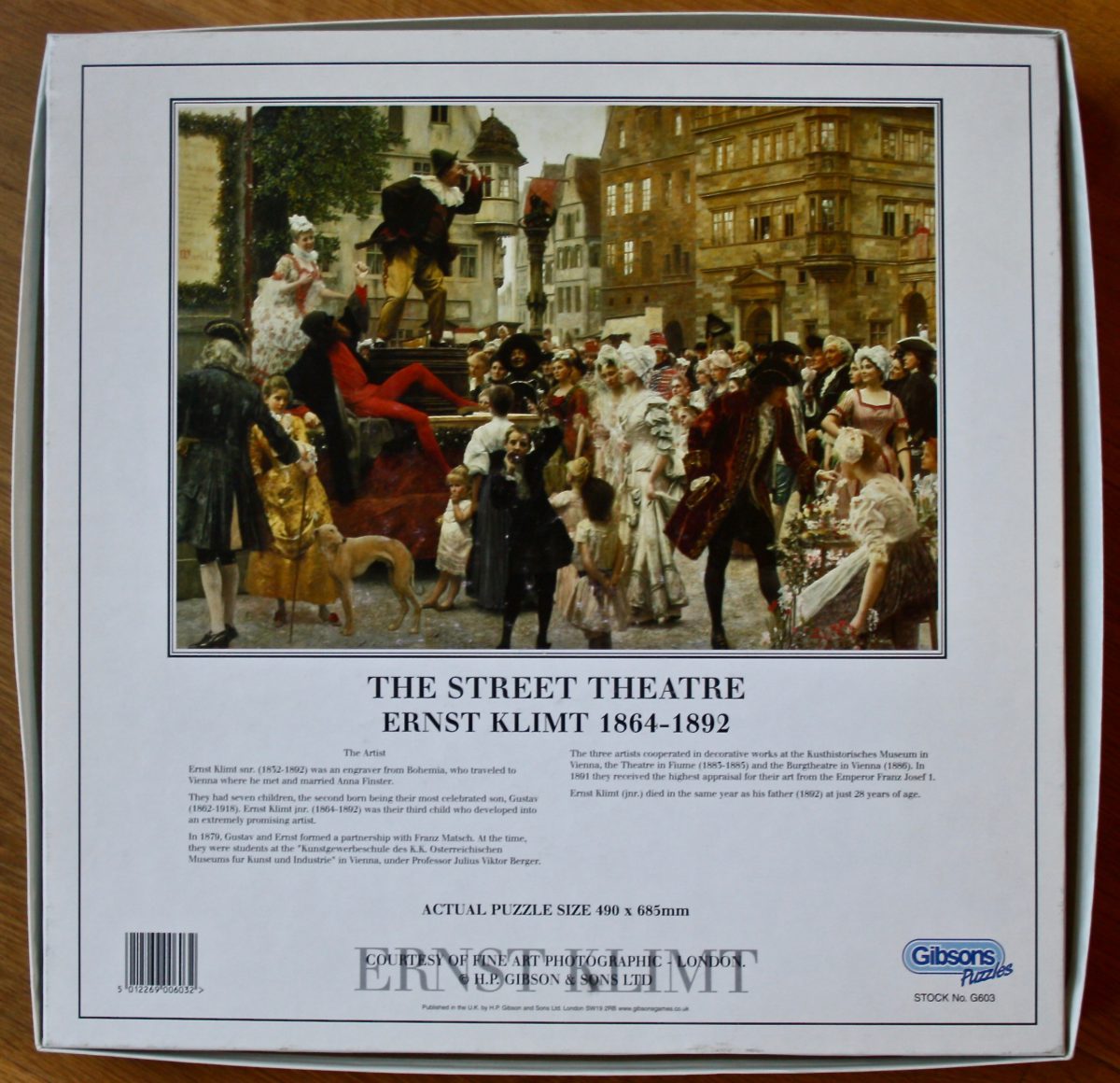 1000, Gibsons, The Street Theatre, by Ernst & Gustav Klimt, Sealed Bag, Listed by ArtPuzzler Image of the puzzle 1000, Gibsons, The Street Theatre, by Ernst & Gustav Klimt, Sealed Bag, Picture of the back