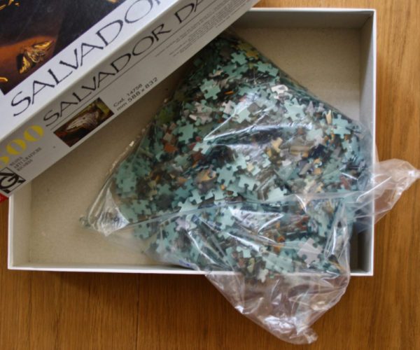 Image of the puzzle 1500, Ricordi, Les Montres Molles, by Salvador Dali, Sealed Bag, Picture of the bag