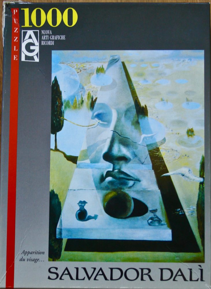 1000, Ricordi, Apparition of a visage, by Salvador Dalí, Sealed Bag, Listed by ArtPuzzler Image of the puzzle 1000, Ricordi, Apparition of a visage, by Salvador Dalí, Sealed Bag, Picture of the box