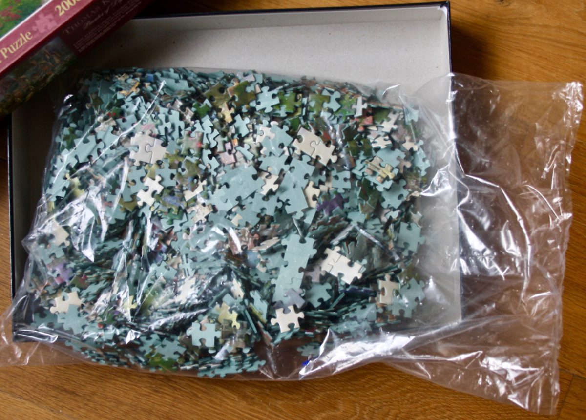 Image of the puzzle 2000, Schmidt, Gardens Beyond Spring Gate, by Thomas Kinkade, Sealed Bag, Picture of the bag