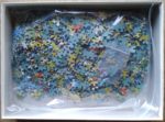 Image of the puzzle 1000, Ravensburger, Park Concert, by Jan van Haasteren, Complete, Picture of the bag