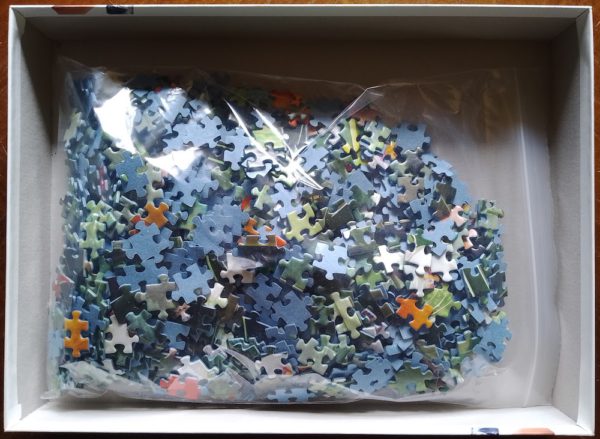 Image of the puzzle 1000, Ravensburger, Cozy Macaws, by Walter Pepperle, Complete, Picture of the bag