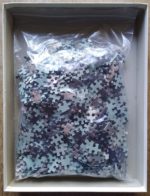 Image of the puzzle 1000, MB, Little Girl with Hat, Complete, Picture of the bag