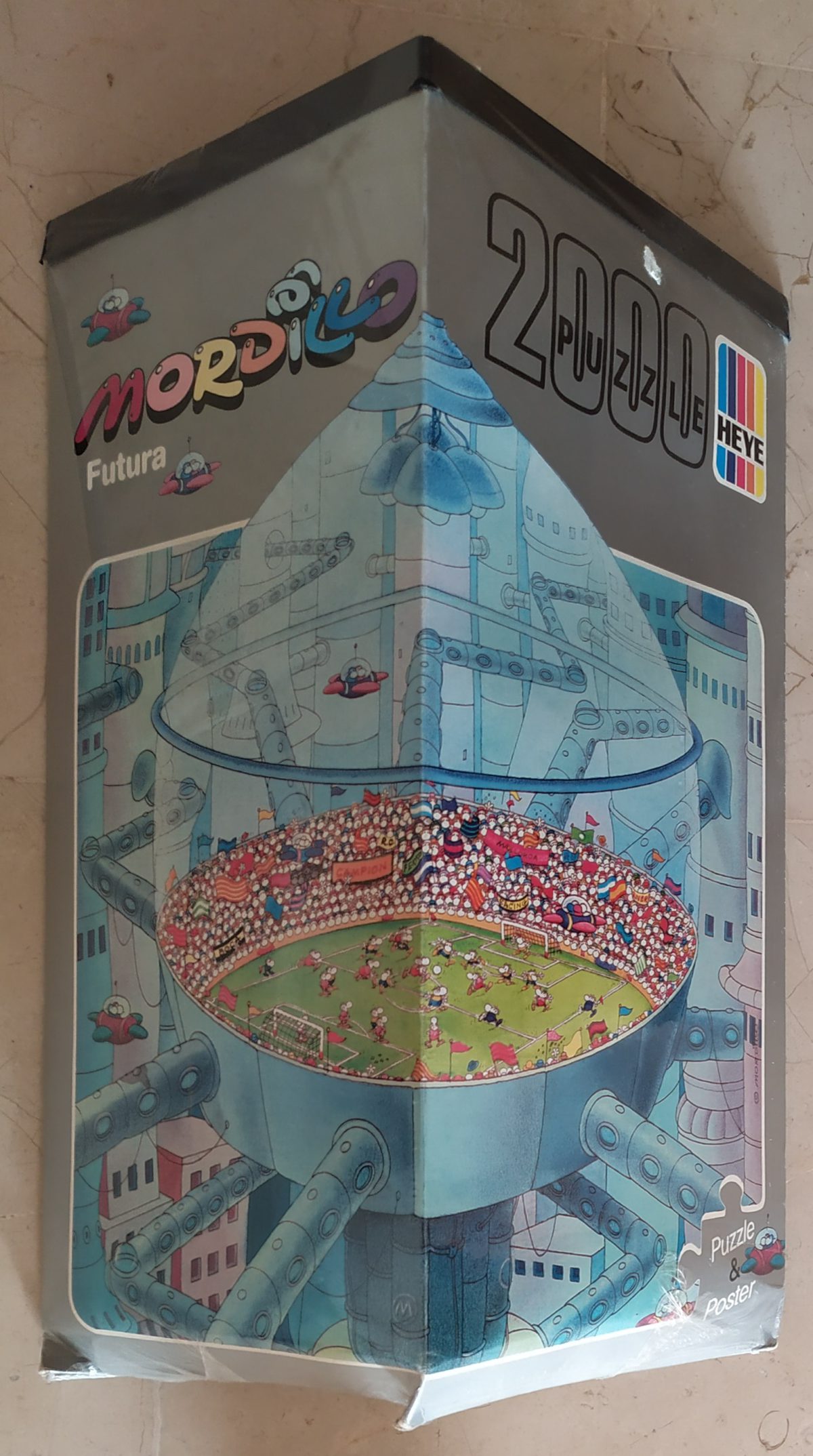 2000, Heye, Futura, Guillermo Mordillo, Factory Sealed, Listed by Barebrain Image of the puzzle 2000, Heye, Futura, Guillermo Mordillo, Factory Sealed, Picture of the box