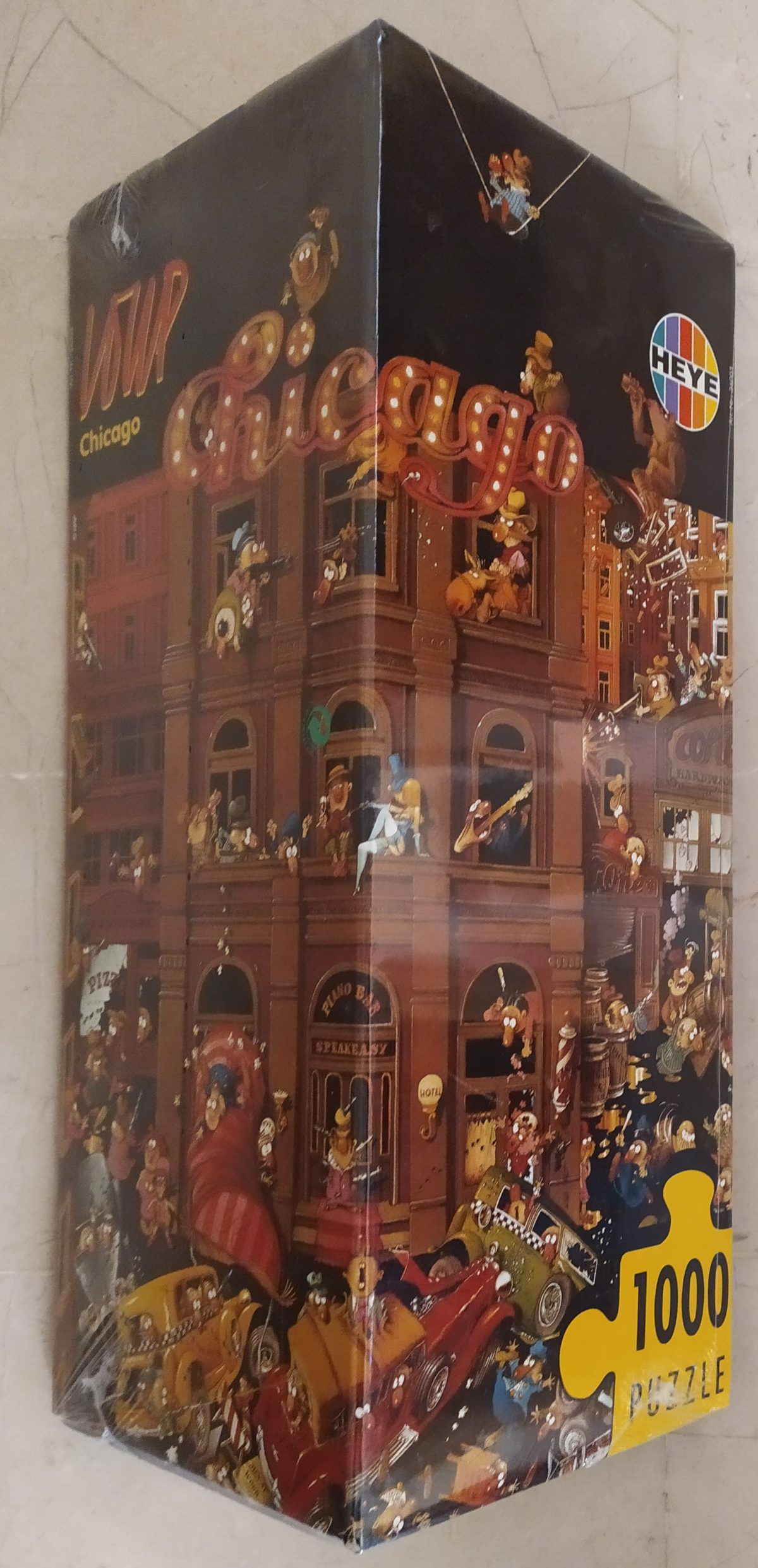 1000, Heye, Chicago, Jean-Jacques Loup, Factory Sealed, Listed by Barebrain Image of the puzzle 1000, Heye, Chicago, Jean-Jacques Loup, Factory Sealed, Picture of the box
