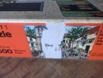 Image of the puzzle 1500, Ravensburger, Village Festival, by Miguel García Vivancos, Complete, Detail of the box