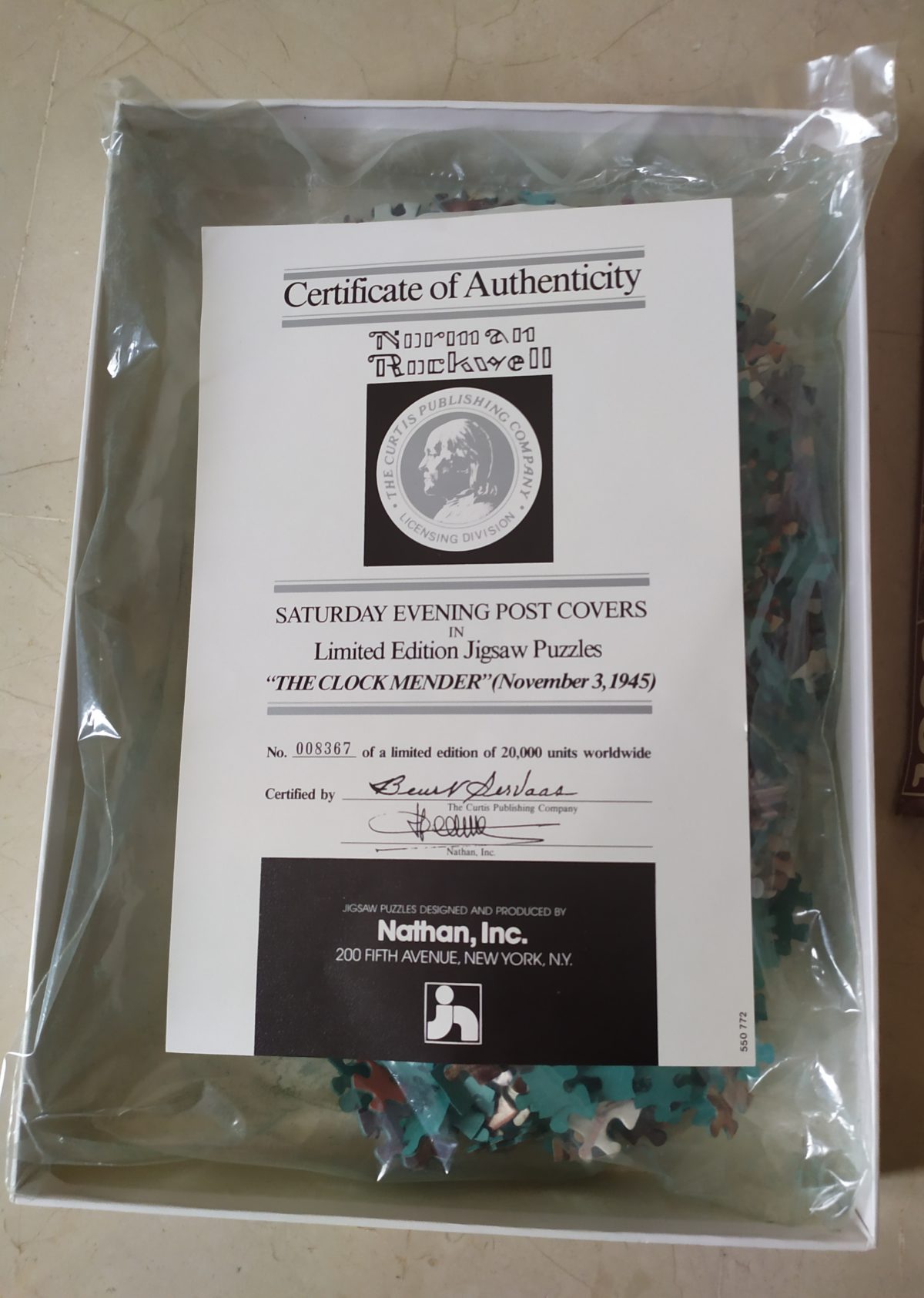 Image of the puzzle 1000, Nathan, The Clock Mender, Norman Rockwell, Sealed Bag, Picture of the certificate