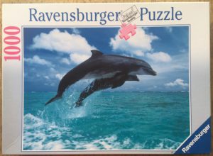 Image of the puzzle 1000, Ravensburger, Dolphins Leaping, Incomplete, Picture of the box