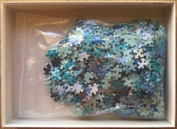 Image of the puzzle 1000, Ravensburger, Dolphins Leaping, Incomplete, Picture of the bag