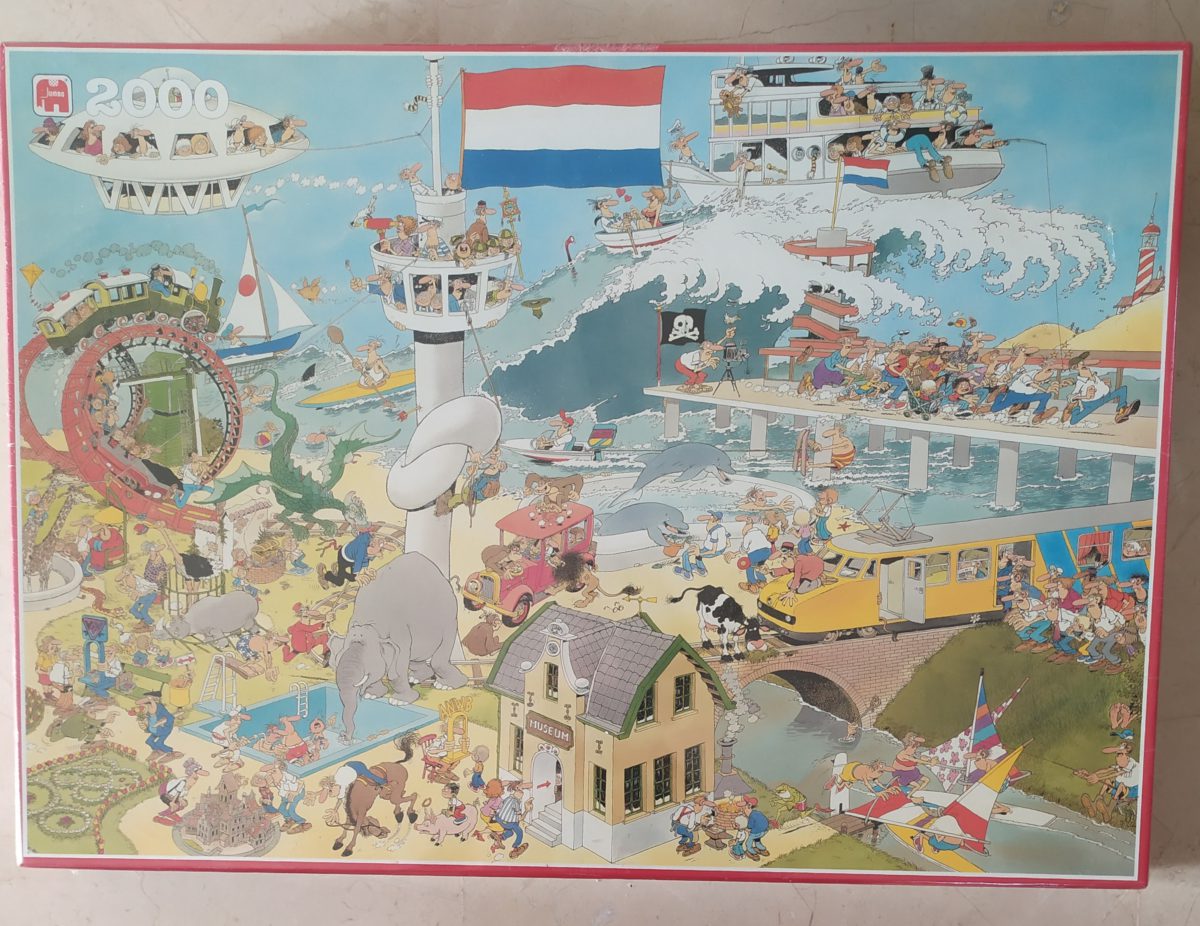 2000, Jumbo, By Air, Land and Sea, by Jan van Haasteren, Factory Sealed, Listed by Barebrain Image of the puzzle 2000, Jumbo, By Air, Land and Sea, by Jan van Haasteren, Factory Sealed, Picture of the box