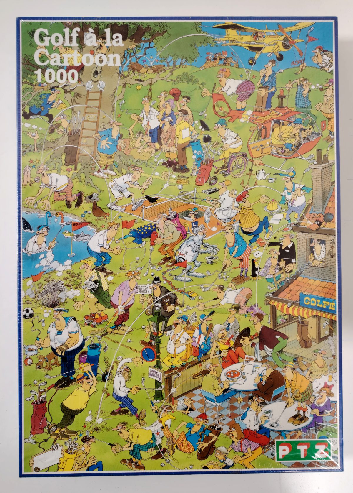 1000, PTZ, Golf à la Cartoon, Jan van Haasteren, Factory Sealed, Listed by RarePuzzlesEurope Image of the puzzle 1000, PTZ, Golf à la Cartoon, Jan van Haasteren, Factory Sealed, Picture of the box