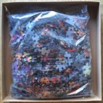 Image of the puzzle 1000, SunsOut, Fairy Tale Collage, Neal Taylor, Sealed Bag, Picture of the bag