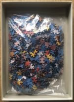 Image of the puzzle 1000, Ravensburger, Tribesman of Garoco, New Guinea, by Jodi Cobb, Complete, Picture of the bag
