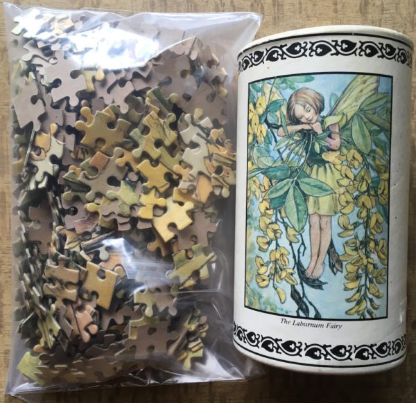 Image of the puzzle 500, Rainbow Designs, The Laburnum Fairy, by Cicely Mary Barker, Incomplete, Picture of the bag