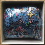 Image of the puzzle 1000, Ravensburger, All that Love in the Middle of the City, by James Rizzi, Complete, Picture of the bag