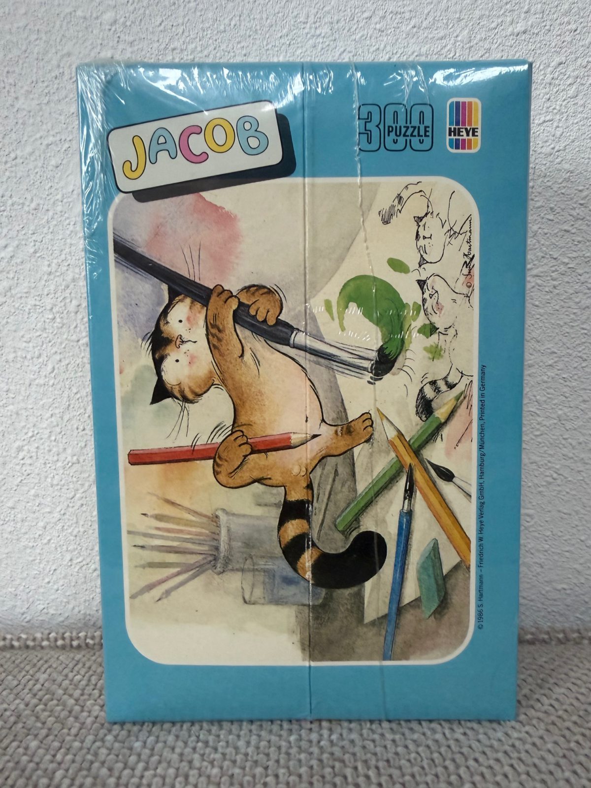 Image of the puzzle 300, Heye, Jacob (8244), by Hartmann, Factory Sealed, Picture of the Box