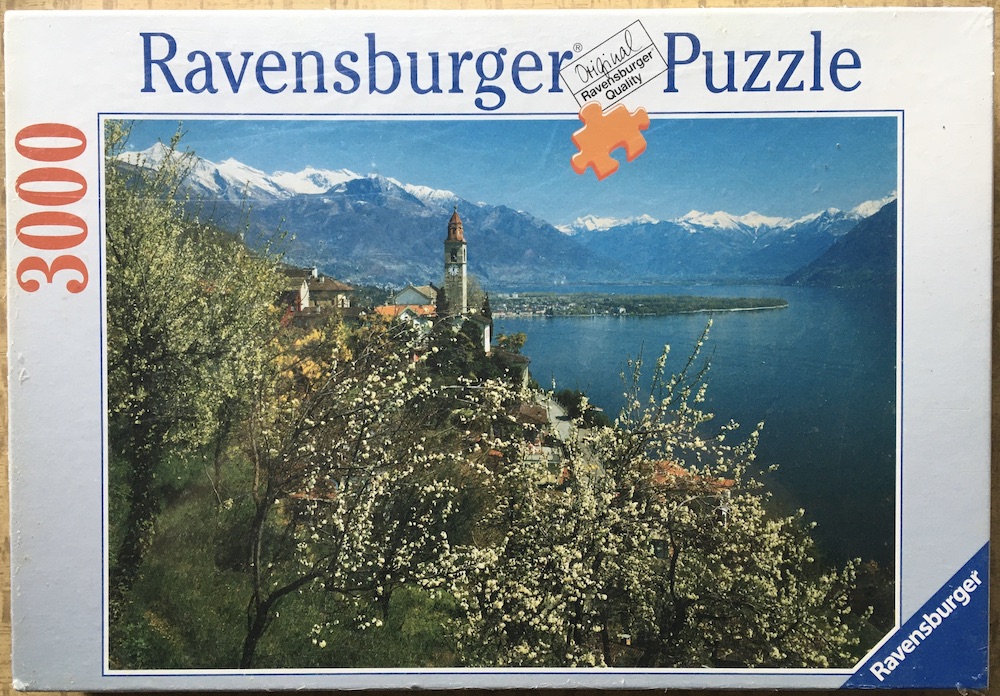 3000, Ravensburger, Spring at Lago Maggiore, Ticino, by by Siegfried Eigstler, Factory Sealed, 2026-02-05 Image of the puzzle 3000, Ravensburger, Spring at Lago Maggiore, Ticino, by by Siegfried Eigstler, Factory Sealed, Picture of the box