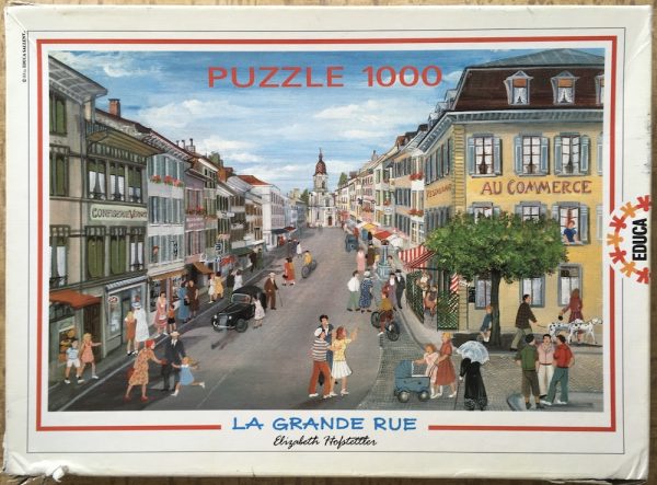 Image of the puzzle 1000, Educa, La Grande Rue, by Elizabeth Hostettler, Sealed Bag, Picture of the box